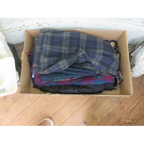 306 - One pair of Ladies Tartan trousers and four ladies tartan skirts