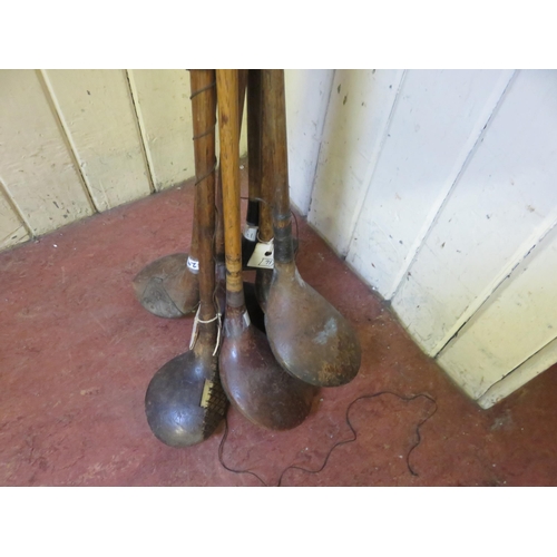 224 - Bundle of seven period wooden shafted Golf Clubs