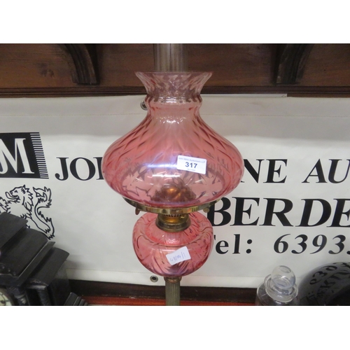 317 - Brass and Cranberry Glass Paraffin Lamp with shade and chimney