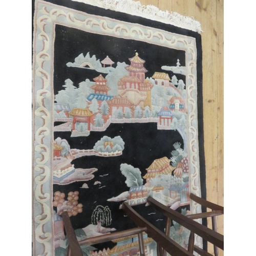 439 - Chinese Wool Rug, deep blue ground with Chinese Palace and Garden Design, in fine condition