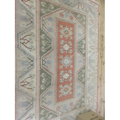 440 - Milas Karyolas Turkish Rug, pale peach colouration, geometric design 240 x 168 cm. in fine condition