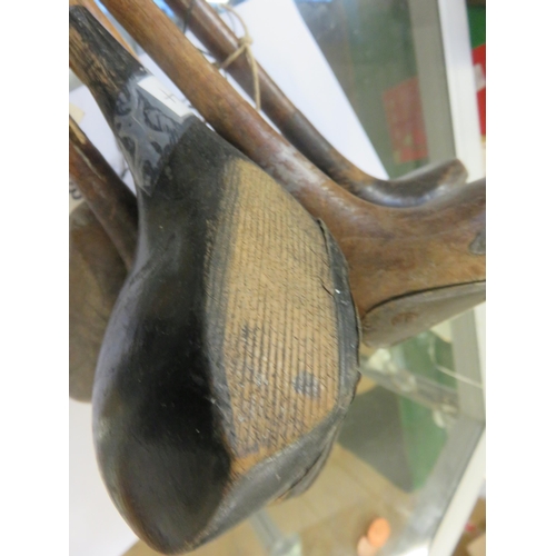 224 - Bundle of seven period wooden shafted Golf Clubs