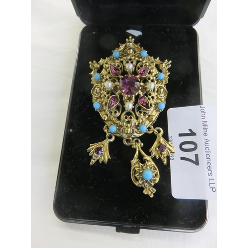 107 - Ornate Gilt Metal Pendant/Brooch with Turquoise. Amethyst and Seed Pearl Type Stones