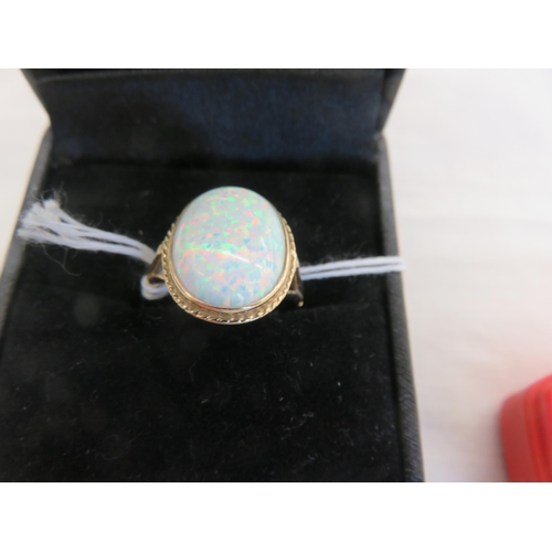 130 - 9ct. Gold and Opal Dress Ring