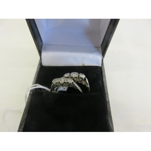 142 - Two small 18ct. Gold three Stone Diamond Rings