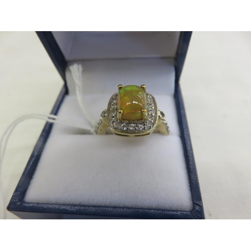 143 - 9ct. Gold Dress Ring with Opal style stone