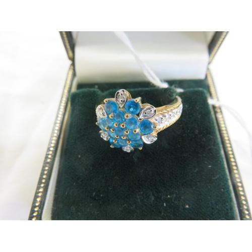 144 - 9ct. Gold Blue and White Stone Cluster Ring