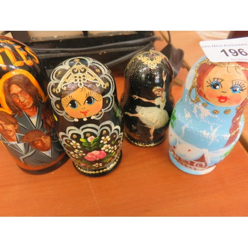 196 - Four five piece Nesting Doll Sets, Beatles, Swan Lake and Traditional multi colour dolls