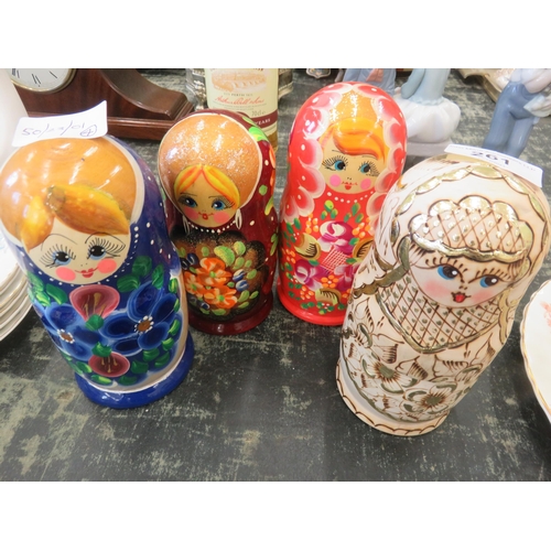 261 - Four Posad style five piece nesting doll sets