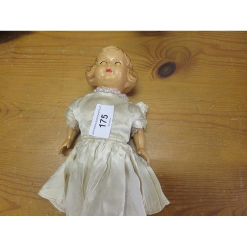 175 - Old Plastic Doll with silk dress