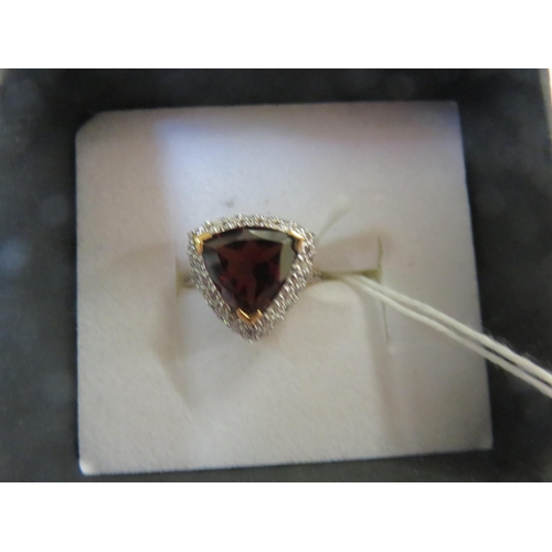 63 - 9ct. Gold Garnet Type Dress Ring