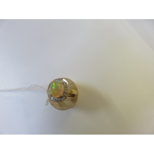 68 - 9ct. Gold and Opal style Dress Ring