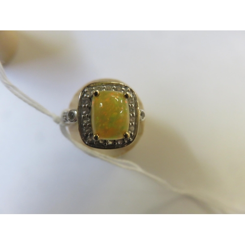 75 - 9ct. Gold and Opal style Dress Ring