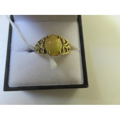 82 - 9ct. Gold and Opal style Dress Ring