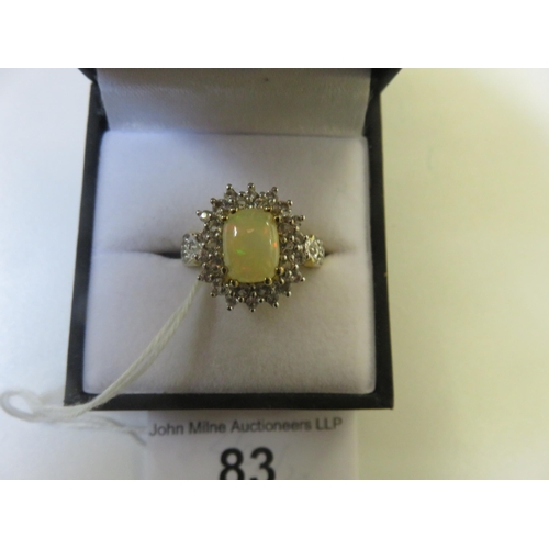 83 - 9ct. Gold, Opal style and White Stone Cluster Ring