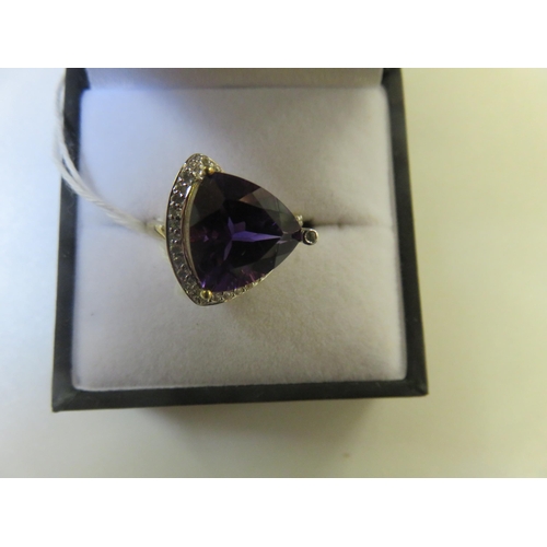 86 - 9ct. Gold and Amethyst style Dress Ring