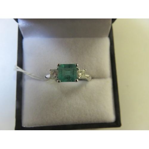 94 - 18ct. White Gold three Stone Emerald and Diamond Ring