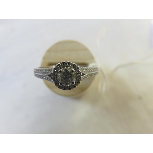 93 - 18ct. White Gold Solitaire and Diamond Chip Ring