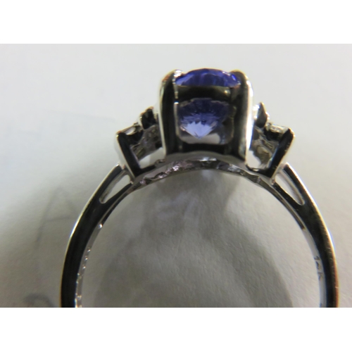 64 - 14ct. white Gold Tanzanite and Diamond Ring