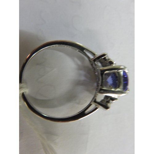 64 - 14ct. white Gold Tanzanite and Diamond Ring