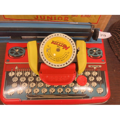 319 - Cased Tinplate Mettype Junior Woking Toy Typewriter