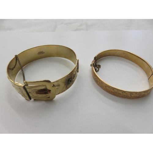 66 - Two rolled Gold Bangles