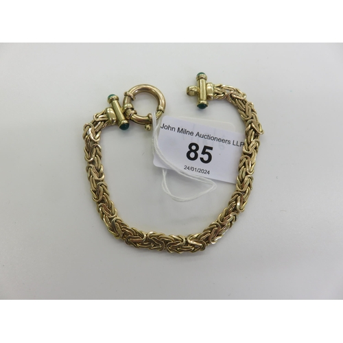 85 - 9ct. Gold Bracelet set with Jade type stones