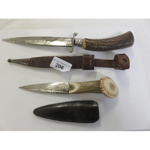 206 - Two Horn Handled Knives in Sleeves