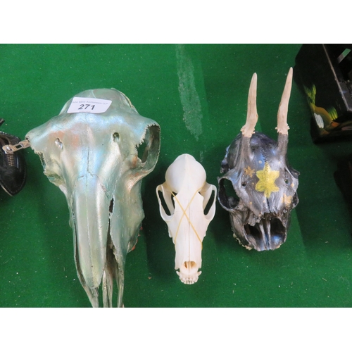 271 - Two painted and one other animal skull