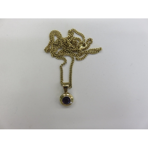 59 - 9ct Gold and Amethyst Pendant on 18ct Gold chain