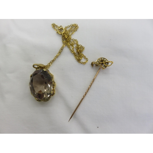 121 - 15ct. Gold and Seed Pearl Horse hoe Pin and 9ct. Gold Smokey Quartz Pendant on Chain