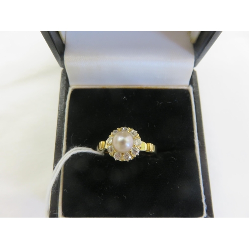 128 - 18ct. Gold Pearl and Diamond Cluster Ring