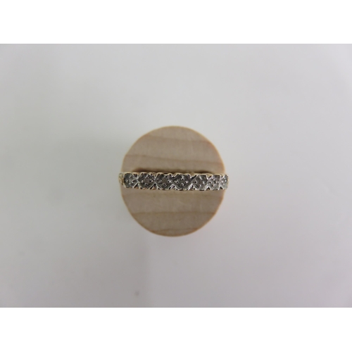 155 - 9ct Gold, Seven White Stone Dress Ring