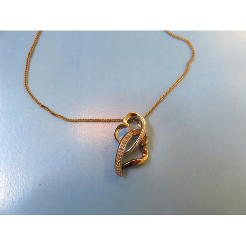 65 - 9ct Gold and Silver Diamond Pendant on Yellow Metal Chain