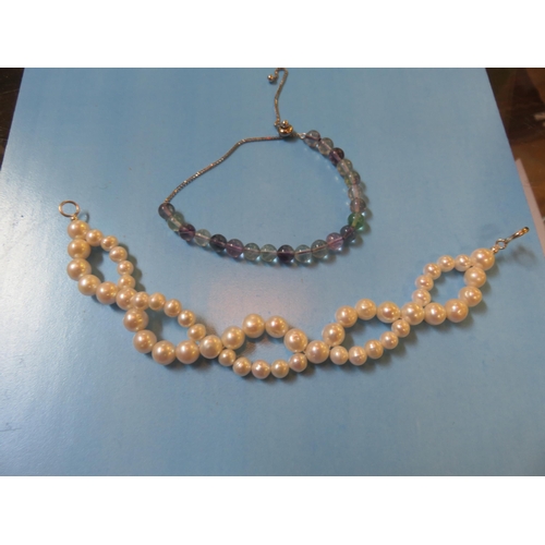 70 - Woven Cultured Pearl Bracelet and a Silver Gem Bracelet