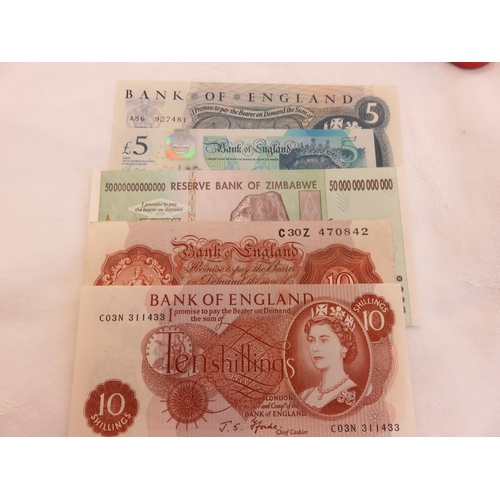 106 - Two Ten Shilling Notes, Two £5 Notes and Zimbabwean Banknote