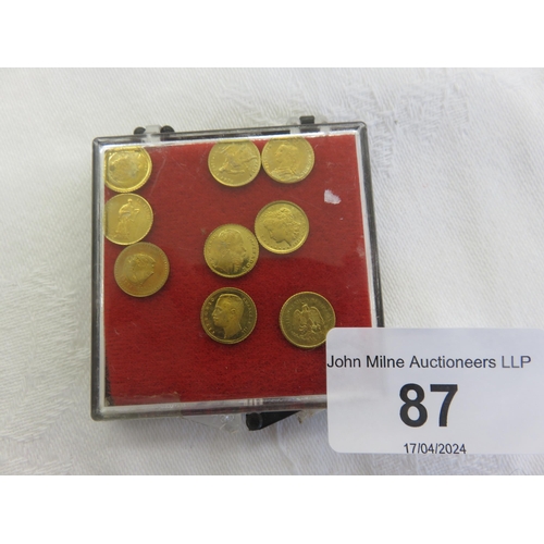 87 - Nine Miniature Yellow Metal Coins