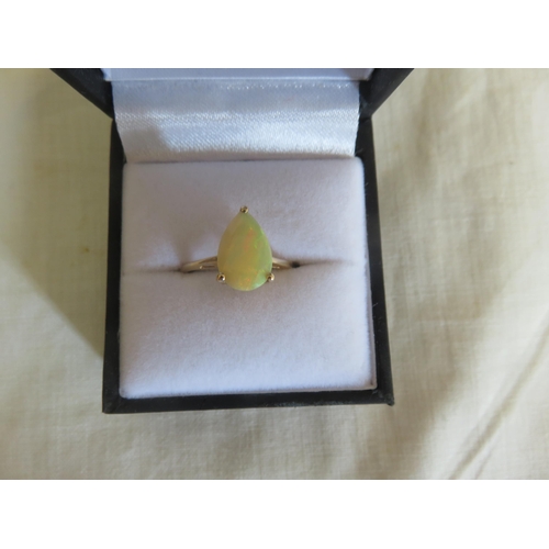 119 - 9ct. Gold and Yellow Opal Dress Ring