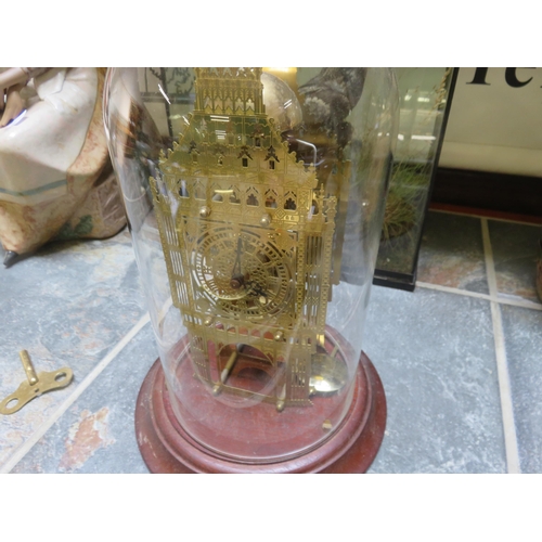 328 - Skeleton Clock in glass dome with key