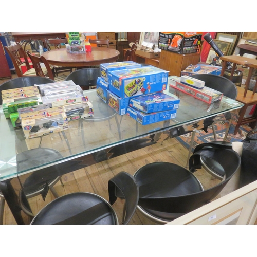 424 - Modern Glass Topped Dining Table and eight chairs