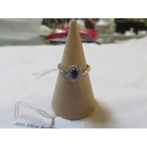 100 - 18ct. Gold Sapphire and Diamond Cluster Ring