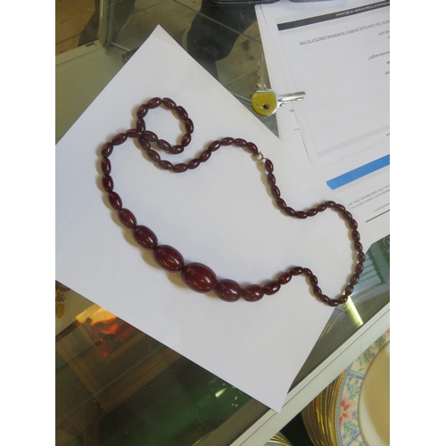 168 - String of Cherry Amber Beads