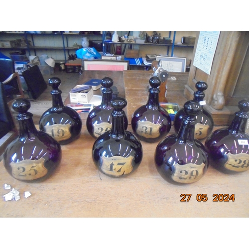 Eight Large Amethyst Glass Apothecary Bottles
