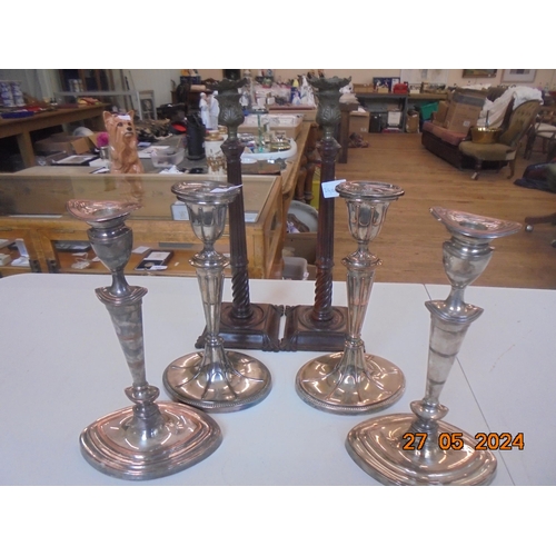 310 - Two Pairs of Plated Candlesticks and Pair of Wooden Sticks