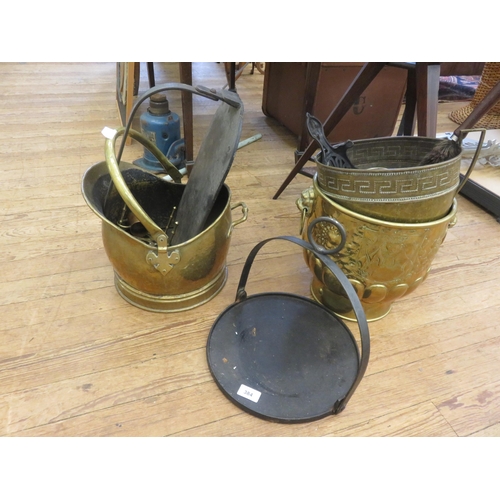 384 - Three Brass Coal Buckets, Two Chamber Sticks, Two Trivets, Two Gridles