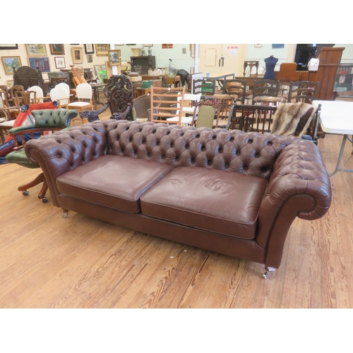 392 - Large Button Back Chesterfield Type Settee on Brown Ground