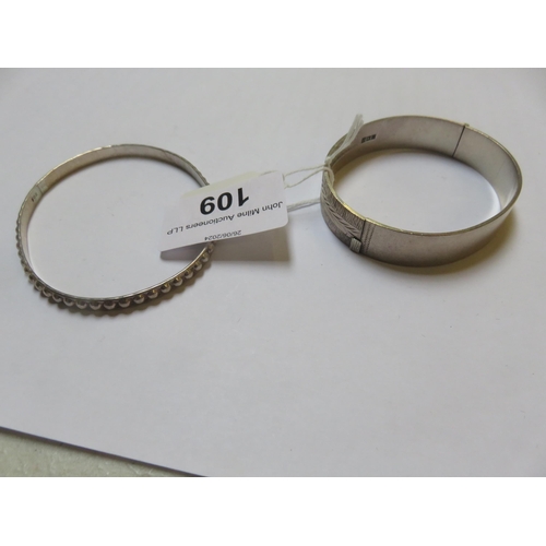 109 - Two Odd Silver Bangles