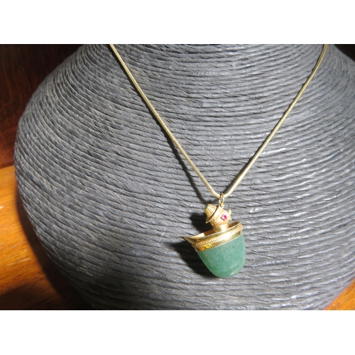 124 - 14ct Gold and Green Hardstone Pendant on 18ct Gold Chain