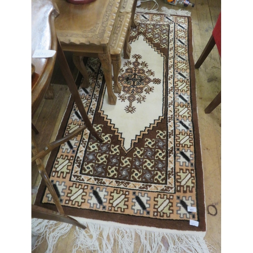 451 - Brown and Beige Fringed Rug