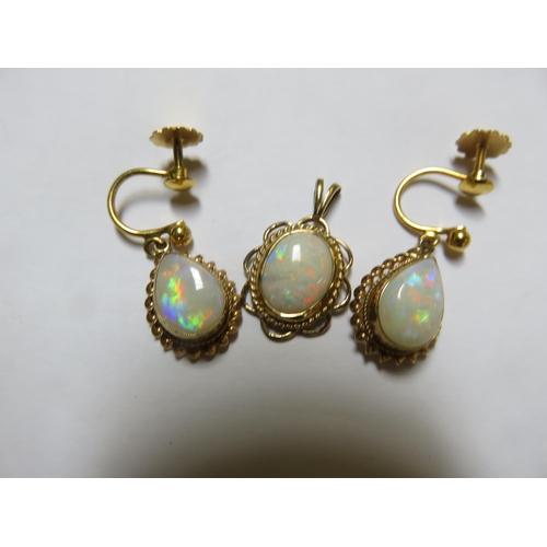 71 - 9ct Gold and Opal Pendant.   pair of Similar Earrings